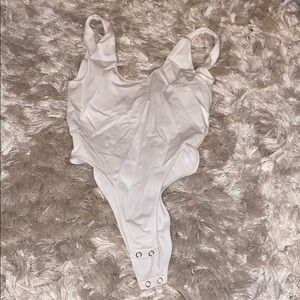 White body suit. Low back